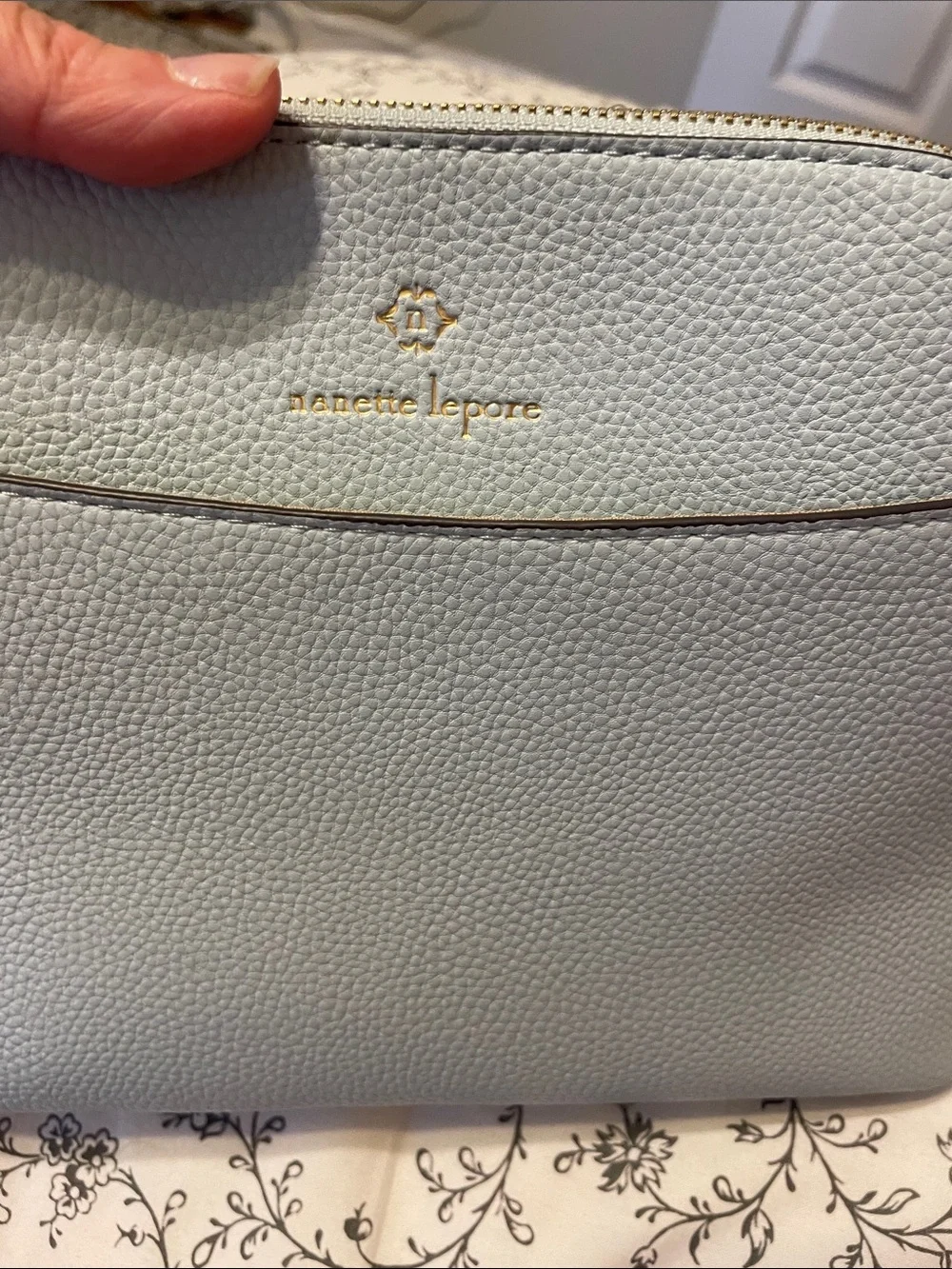 Elegant Light Blue Crossbody Bag with Gold Accents never used